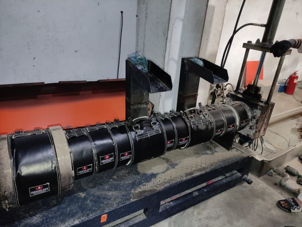 ThermoSave insulation jackets wrapped around an extruder barrel with feed chutes