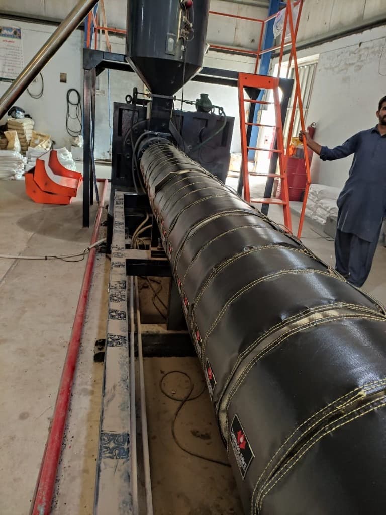 Extrusion line hopper with ThermoSave insulation jackets on the barrel